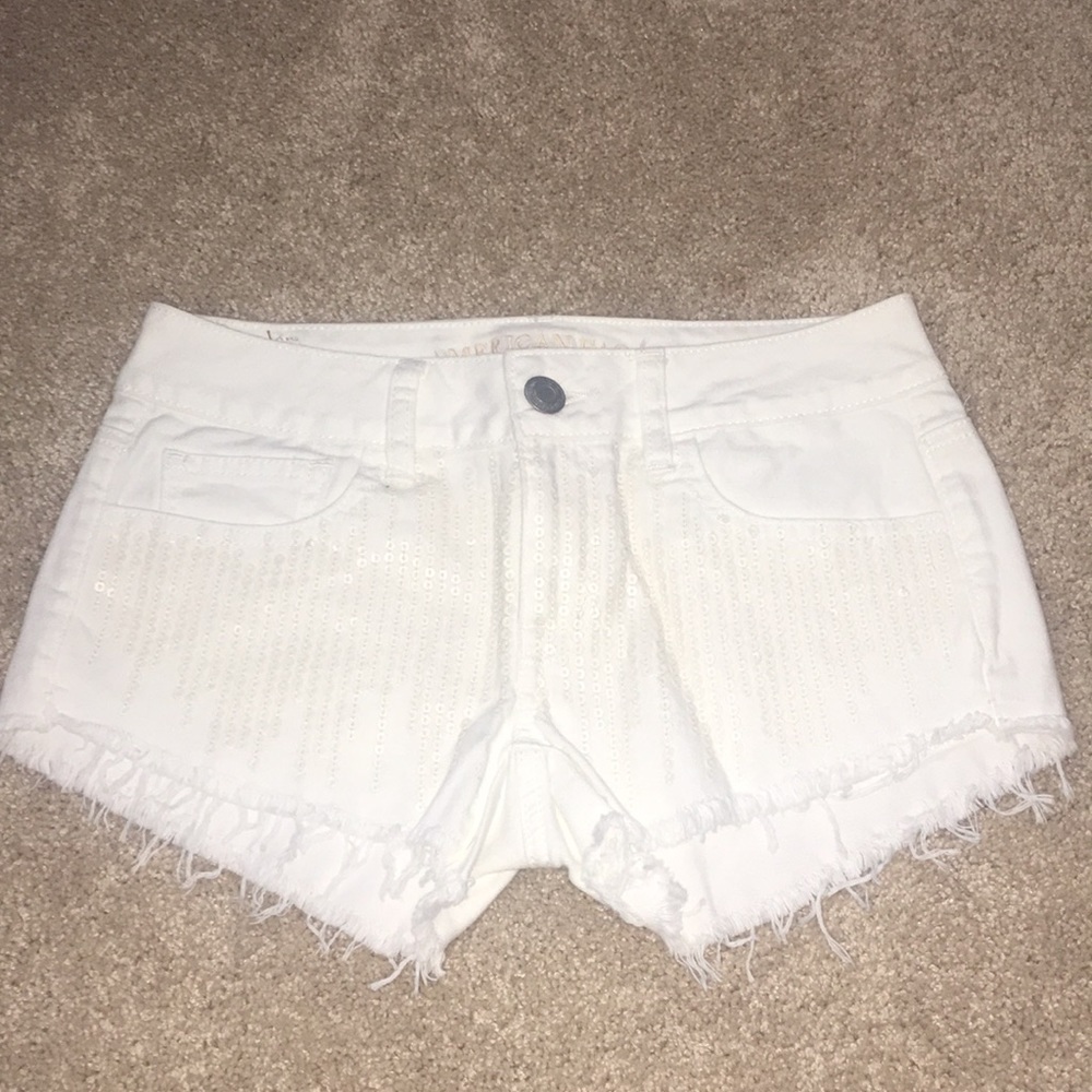 White sequin jean shorts